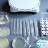 Different microbiology laboratory equipment (petri dishes, pipette, media, incubator)